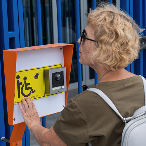 An,Elderly,Blind,Woman,Reading,A,Text,In,Braille.,Button